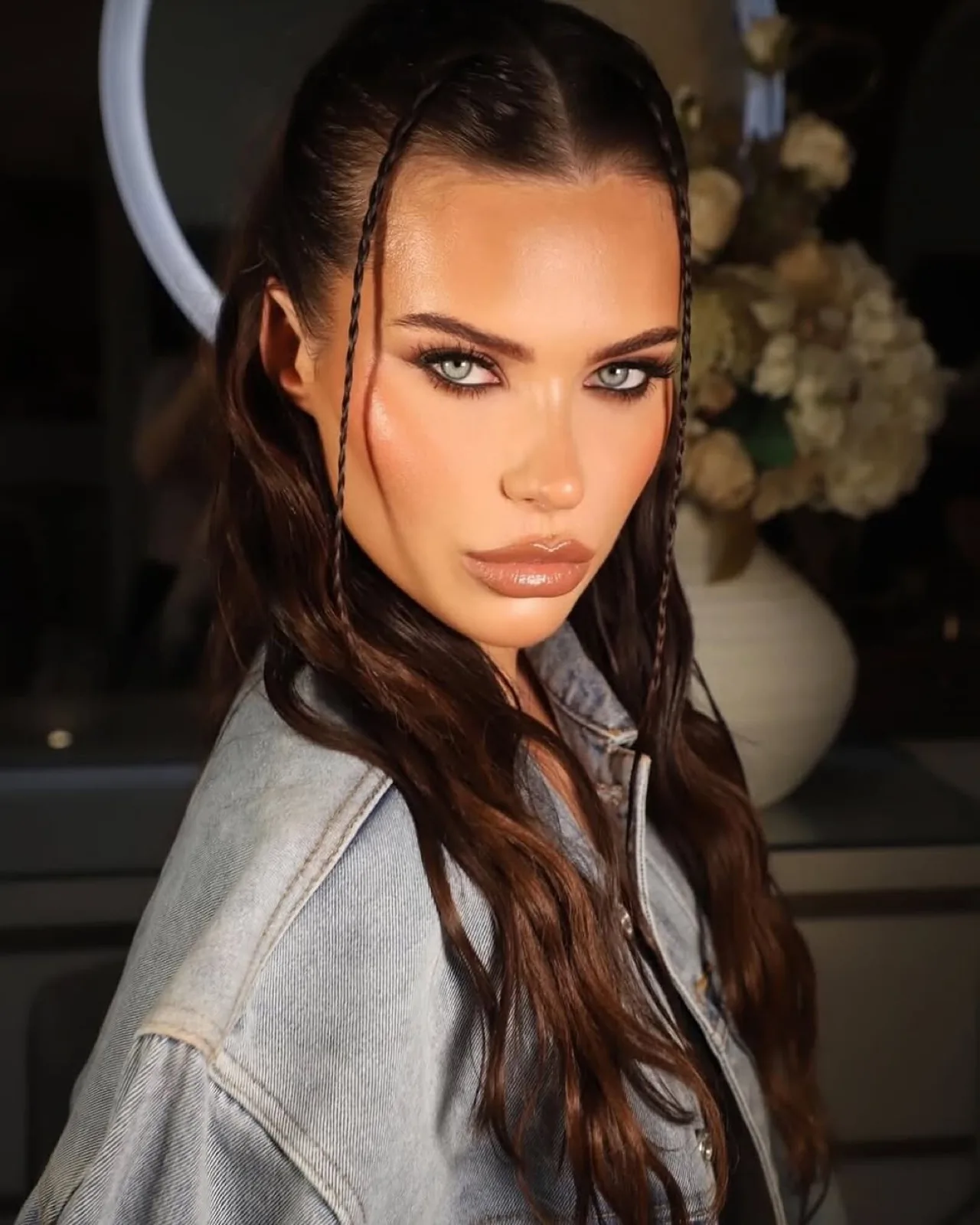 Bronzed glam makeup with soft smoky eyes and glossy nude lips, created by Leyla McDowell