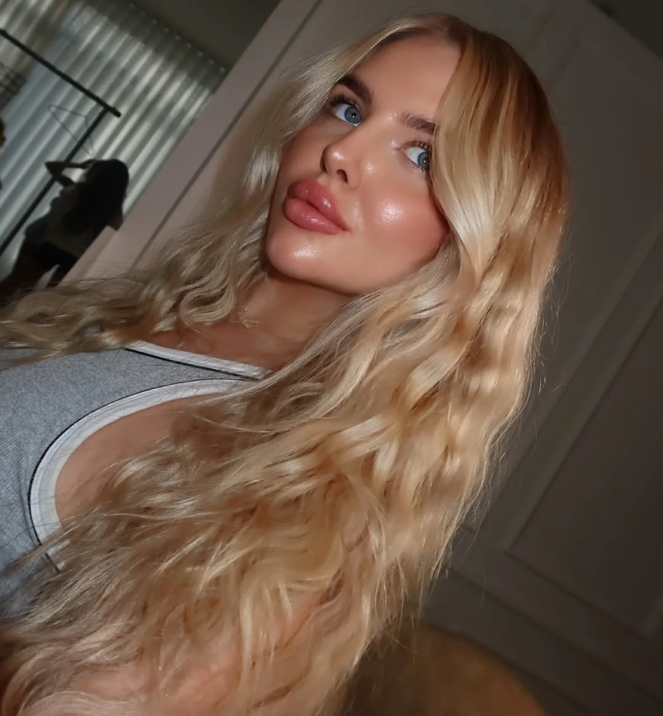 Soft radiant bridal style makeup with glowing skin and natural glossy lips